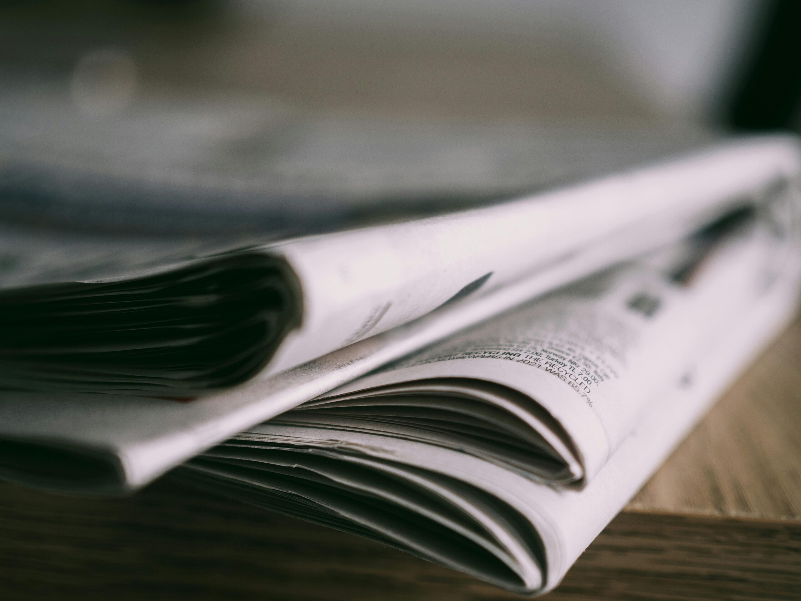 Image of a stack of newspapers, showing affordable watch reviews.