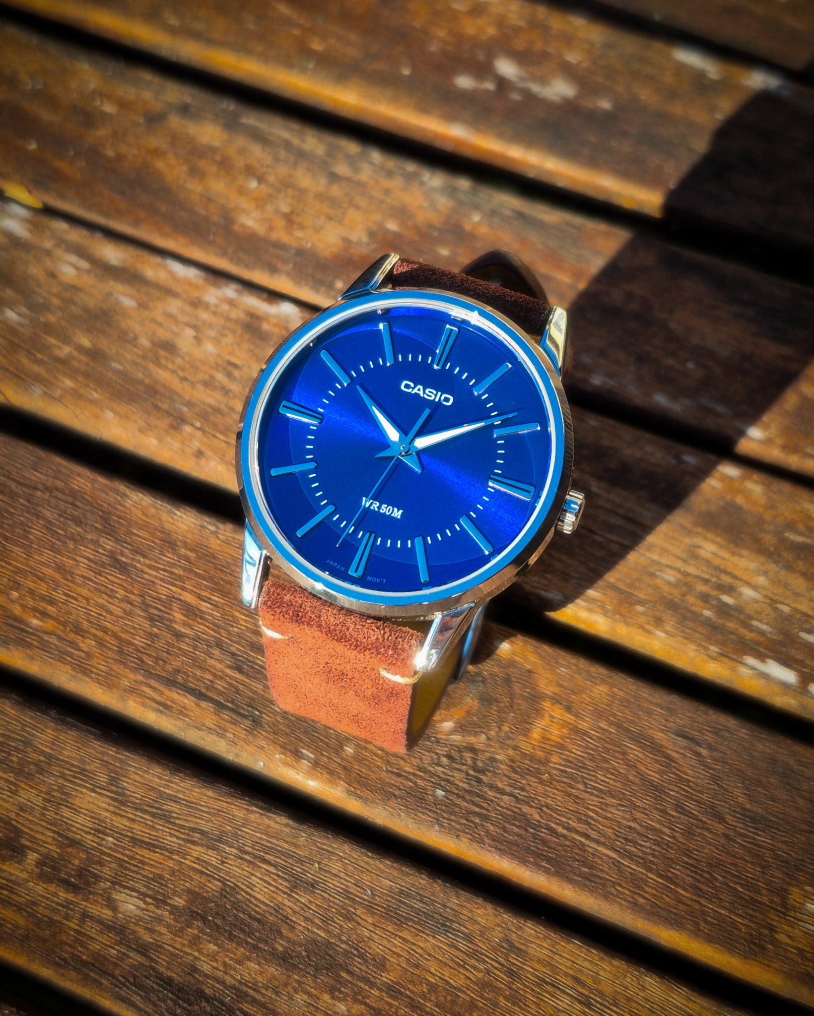 Casio-MTP-1303PD-2AV watch on a wooden table