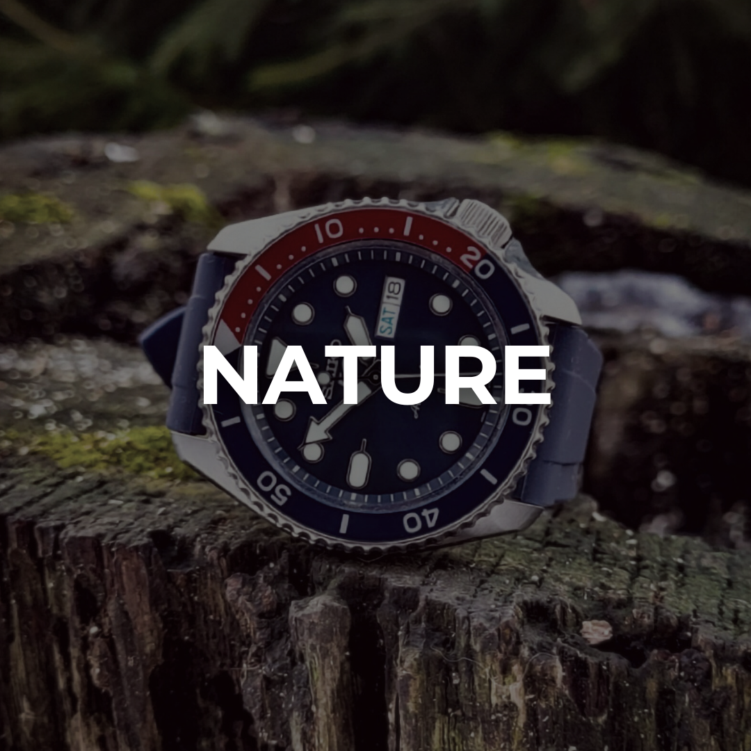 Dive watch placed on mossy tree stump in natural forest setting — nature watch photography