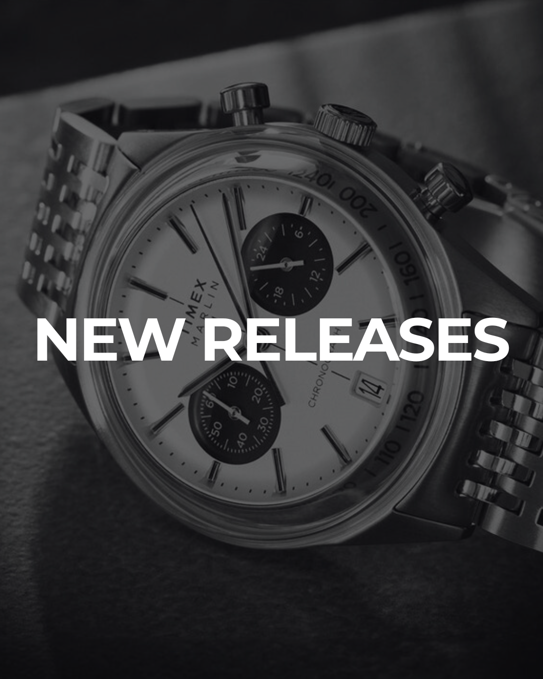 Close-up of a chronograph watch on display, symbolizing new watch releases
