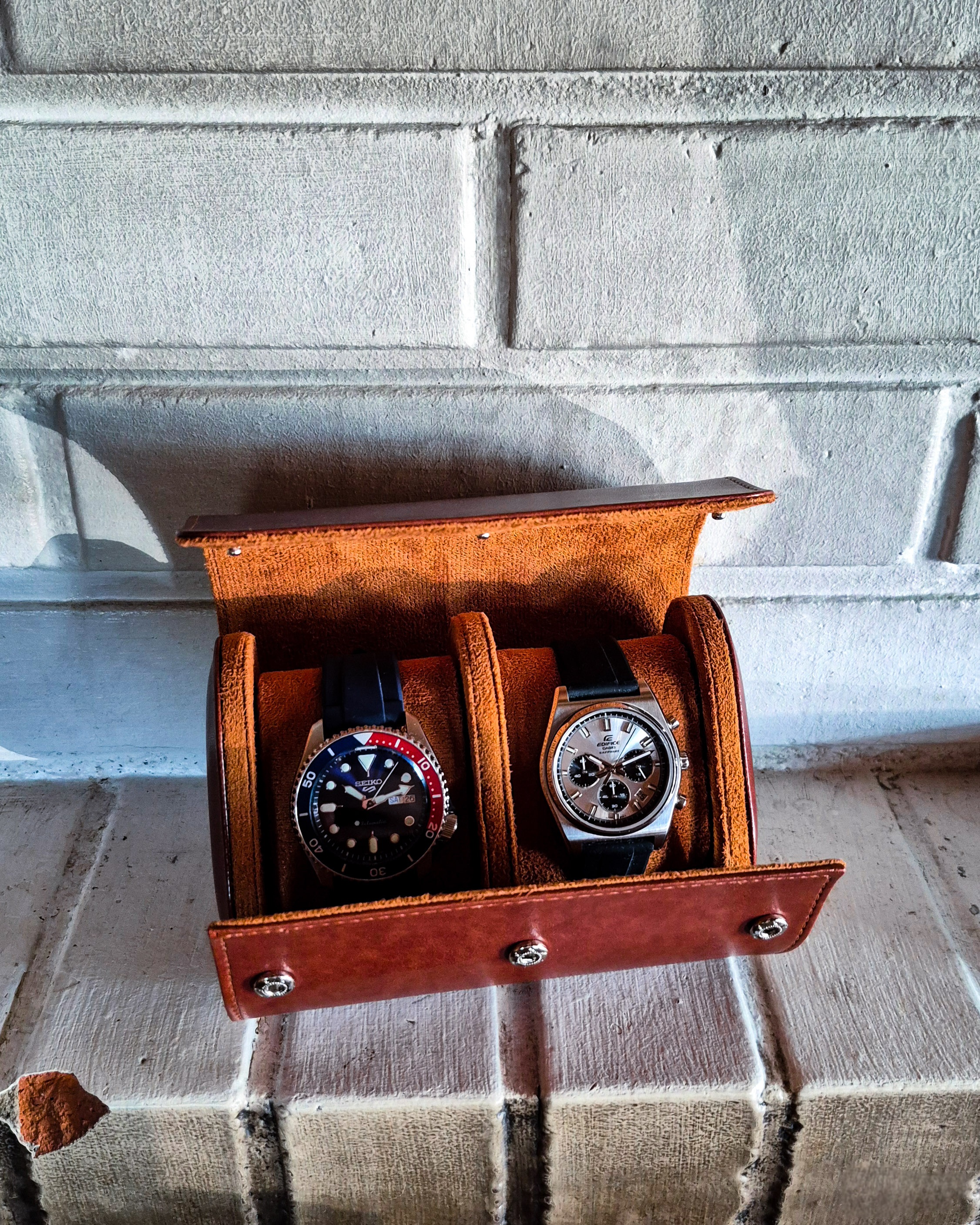 Casio Edifice EFB-730D-7AV and Seiko SRPD53 in a brown watch leather roll